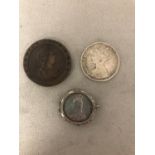 Three C19th coins, a George III 1797 cartwheel two pence, a Victorian Florin and a coin brooch