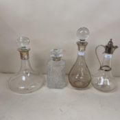 A hallmarked silver claret jug, and two modern hallmarked silver decanters, and a cut glass square