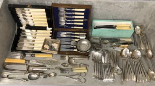 A large collection of silver plated wares to include boxed sets caddy spoons, asparagus tongs and