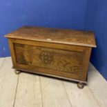 A modern oak storage chest with riding lid