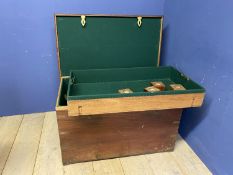 A large heavy teak and brass bound silver chest, opening to reveal a green baize fitted interior,