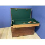 A large heavy teak and brass bound silver chest, opening to reveal a green baize fitted interior,