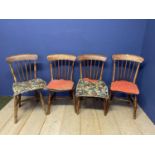 A set of 4 elm seated Windsor stick back cottage chairs