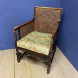 A square framed bergere caned arm chair