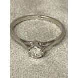 Single stone platinum and diamond ring in four pronged setting, oval old cut diamond 2g size M