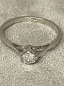 Single stone platinum and diamond ring in four pronged setting, oval old cut diamond 2g size M