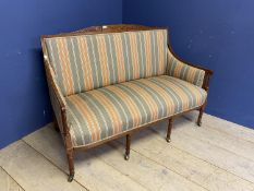 A satinwood and line inlaid show framed settee, with column legs to castors and in a grey and orange