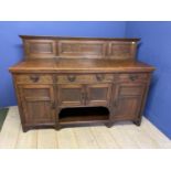 An oak sideboard, with 4 drawers and cupboards,178cm Wide