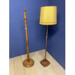 Two wooden lamps, a turned oak example and one othe 148cm approx