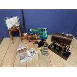 A quantity of house clearance items to include a cased Singer sewing machine, a brass bed warming