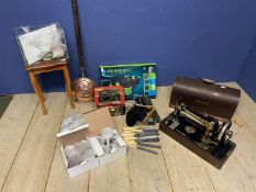 A quantity of house clearance items to include a cased Singer sewing machine, a brass bed warming