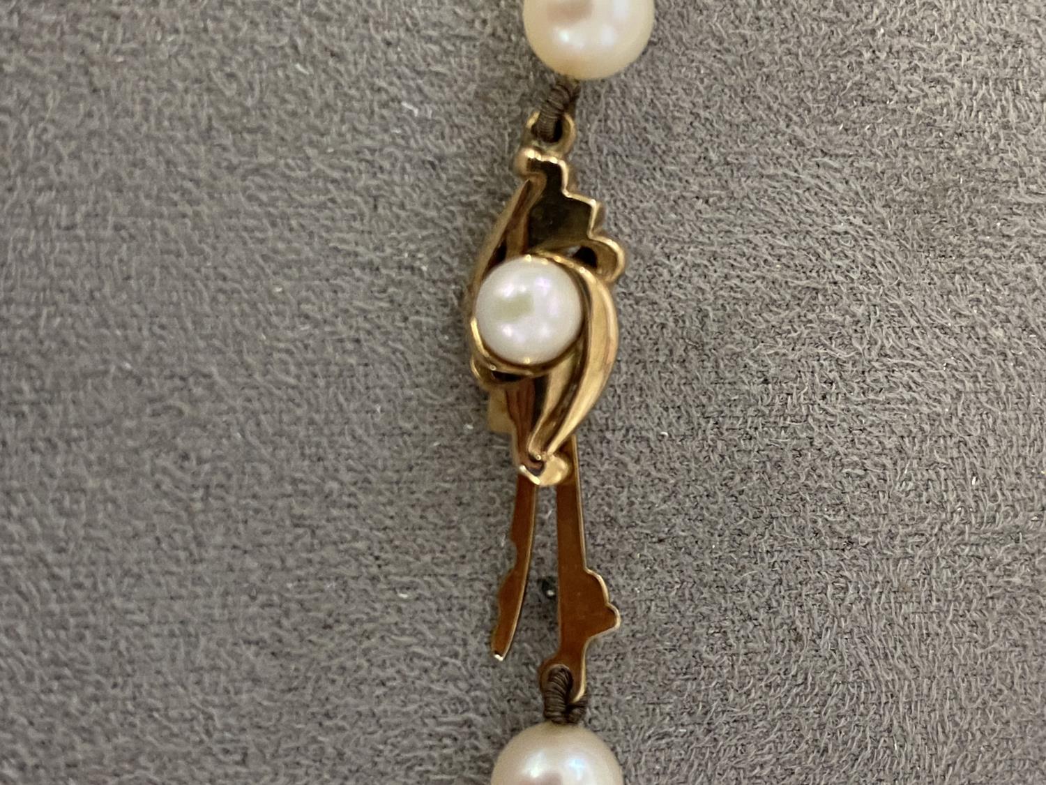 A single strand of cultured uniform pearls by Mikimoto on a 9ct gold clasp with box and certificate, - Image 3 of 5