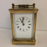 French gilt brass carriage clock with 4 bevelled glass panes with key