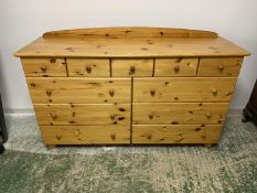 A modern pine chest of 11 drawers, 155cm L x 95cmH