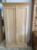 A pine two door wardrobe, with loose hanging pole rail, 188cmH x 92cm W approx.