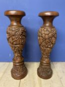 Pair of profusely carved oriental style hardwood floor vases, 79cmh