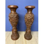 Pair of profusely carved oriental style hardwood floor vases, 79cmh