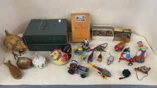 A quantity of tin plate toys, loose cigarette cards, and a vintage GWR jig-saw puzzle about 200