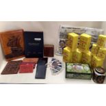 Quantity of advertising tins and 4 posters ; and a quantity of leather goods including blotters,