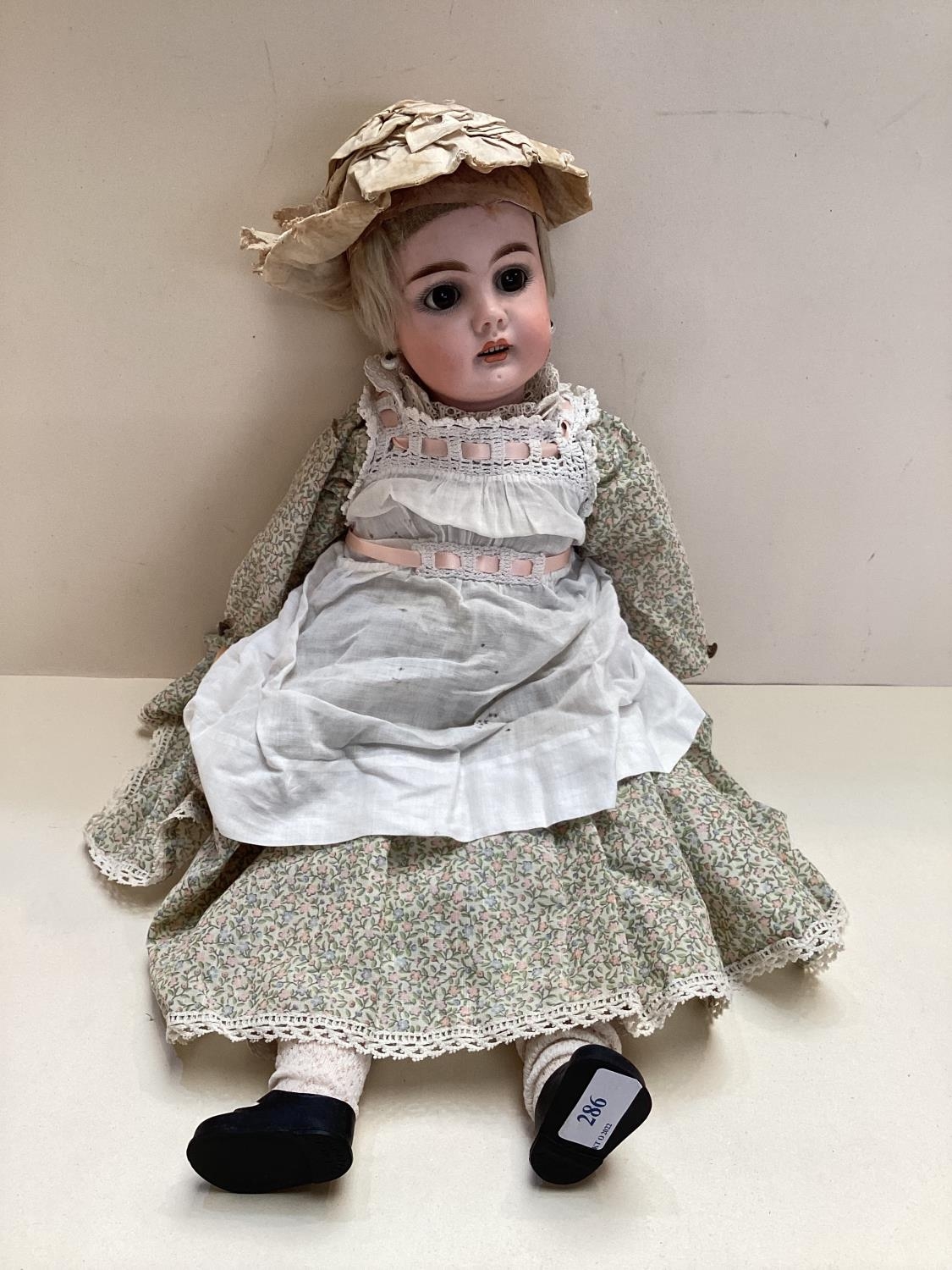 Later C19th/early C20th Continental Bisque headed doll, with open glass eyes glass and mouth, with