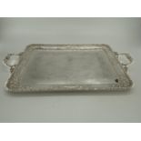 Three silver plated oblong trays with applied loop handles, largest 68 x 41cm