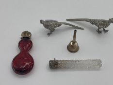 Two Sterling silver topped scent bottles, and 2 white metal table pheasants and a small funnel