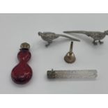 Two Sterling silver topped scent bottles, and 2 white metal table pheasants and a small funnel