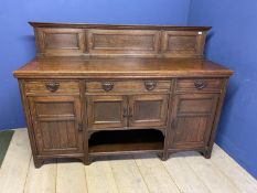 An oak sideboard, with 4 drawers and cupboards,178cm Wide