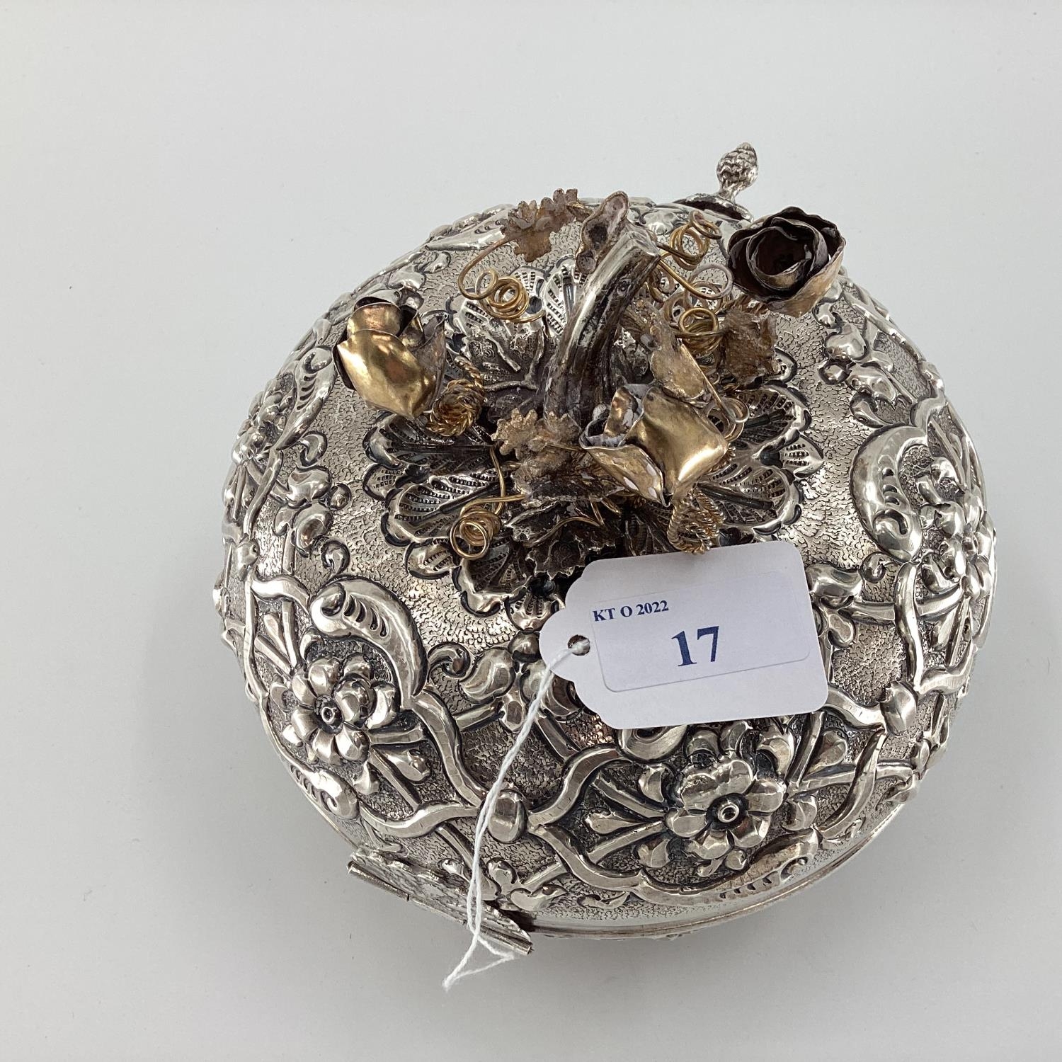 A white metal Middle Eastern style circular casket with raised decoration, gilt floral finial and - Image 6 of 6