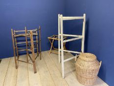 A quantity of vintage towel rails, luggage racks, bed tray, wicker laundry basket etc; all with