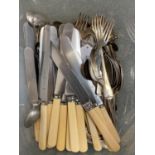 A collection of plated flatware
