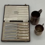 A sterling silver mug, together, together with a silver christening cup and boxed silver handled