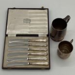 A sterling silver mug, together, together with a silver christening cup and boxed silver handled