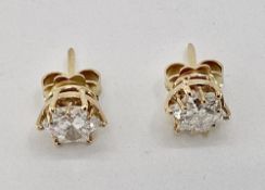 Pair of C18ct gold fancy star cut diamond ear studs approx 8mm diam each, in a 12 claw setting ,