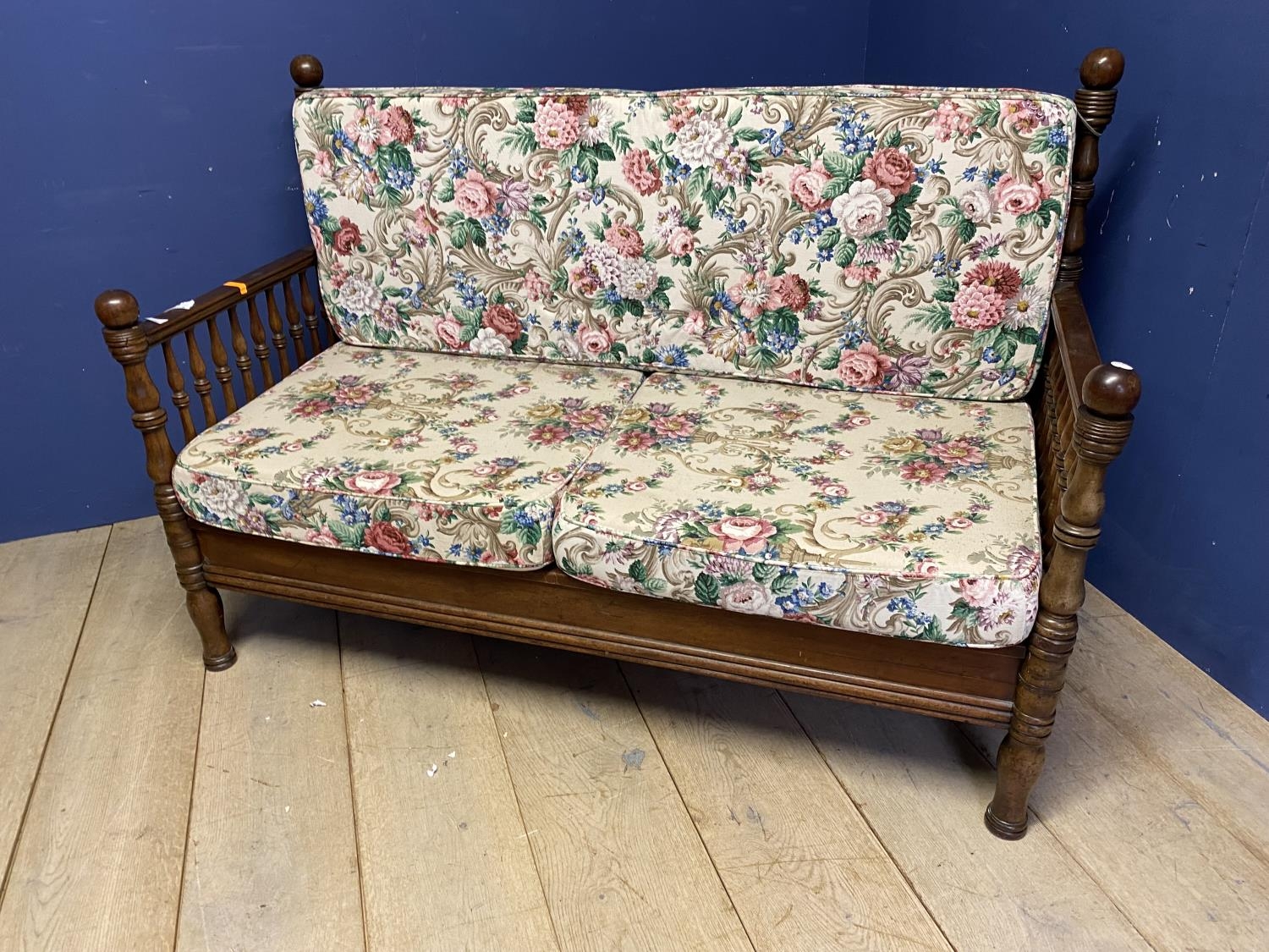 Walnut framed settee with galleried sides and back rails, on raised turned legs, and loose