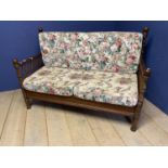 Walnut framed settee with galleried sides and back rails, on raised turned legs, and loose