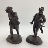 Two bronze figures of a cavalier and a soldier on cast oval bases, 37cm