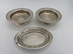 A collection of silver plated items to include a large circular tray, a circular footed tray and