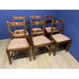 A set of early C20th beech small cottage style dining chairs ,with upholstered drop in seats, some