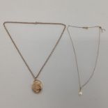 9ct gold back and front oval locket on a 9ct gold belcher link necklace, gross 8g; and a synthetic