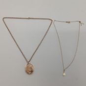 9ct gold back and front oval locket on a 9ct gold belcher link necklace, gross 8g; and a synthetic