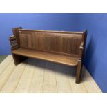 An oak ecclesiastical style settle bench