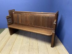 An oak ecclesiastical style settle bench