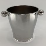 An Alessi white metal wine ice bucket stamped to base Alessi Italy, Carlo Alessi 1952, 21 x 29cm