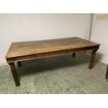 A large teak style rectangular table (one loose leg - needs attention)