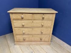 A blond Ash chest of 2 short over 3 long drawers, with knob handles, 106cm Wide, splits to each side