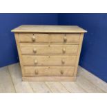 A blond Ash chest of 2 short over 3 long drawers, with knob handles, 106cm Wide, splits to each side
