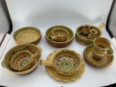 A quantity of decorative rustic Provenance pottery, in yellow and green ground decorated olives
