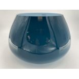 A large Art Glass table centre bowl, with blue exterior. 30cm H x 44cm at widest point