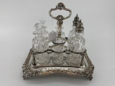 Silver plated condiment holder (one vacant glass vase) together with four oval plated trays